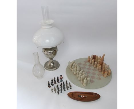 African hard stone chess set and board with novelty pieces, together with a silver plated oil lamp and a collection of lead t