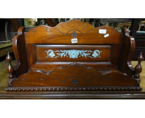 A Victorian mahogany wall bracket/shelf with turned detail and stencilled decoration