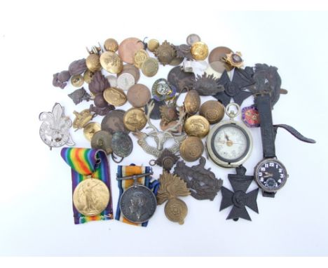 A collection of military lapel badges 14-18 and victory medals named to lieutenant A Phillips, silver cased military watch ma