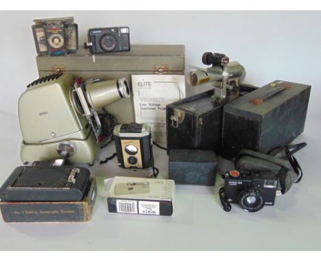 A collection of vintage cameras and projection equipment.