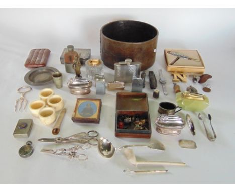 A box of interesting items to include various vintage lighters, white metal, mother of pearl, etc.