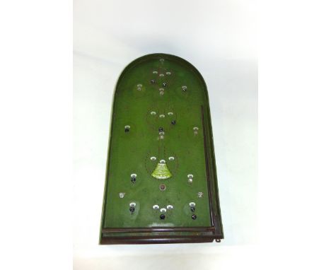 A vintage Corinthian bagatelle board with ball bearings. 