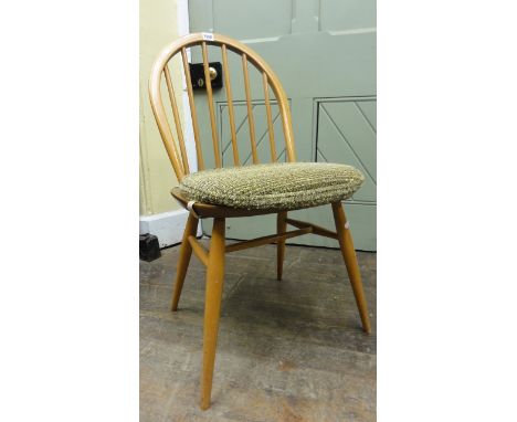 A set of six Ercol light elm Windsor dining chairs.