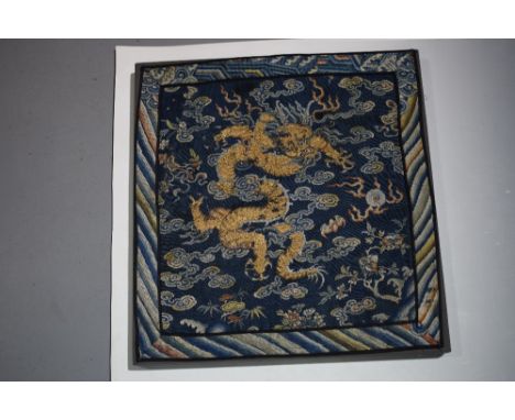 Two Chinese woven panels, 19th century, the first embroidered a dragon in gold coloured metal thread, mounted on a wooden fra