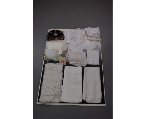 Collection of good quality white linen including a damask banqueting cloth, woven with ribbon tied flowers, 106in. X 87in. 27