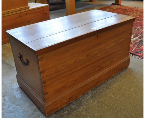 Vintage pine trunk with hinged lid, the interior revealing fitted candle box with cast metal handles.(B.P. 21% + VAT) 