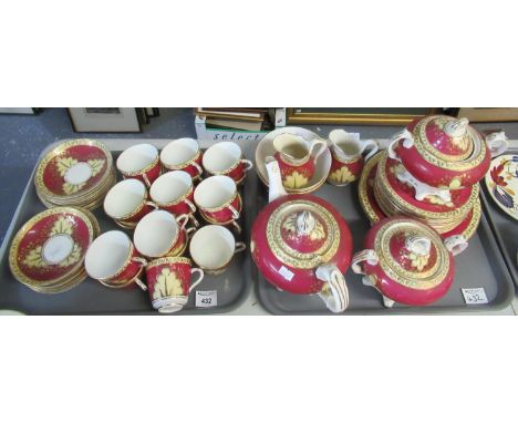 Two trays of maroon and yellow foliate design teaware including; teapot, sucrier, milk jug, teacups and saucers, plates etc. 