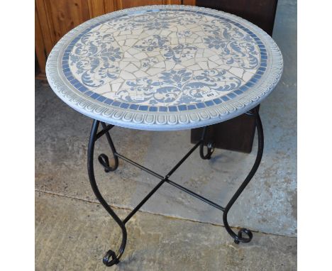 Modern florally decorated tile top circular conservatory or garden table on metal tubular base. (B.P. 21% + VAT) 