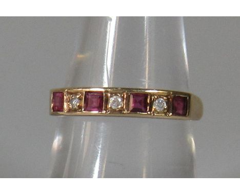 9ct gold ruby and diamond half eternity style ring. Ring size N. Approx weight 2.1 grams. (B.P. 21% + VAT)Tiny chip to one ru