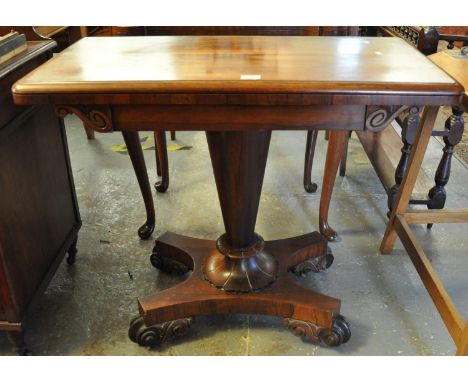 19th Century rosewood card table standing on a quatreform base with scroll supports. (B.P. 21% + VAT)&nbsp;Scratches, especia