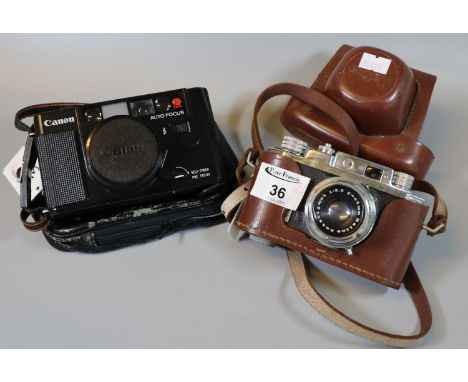 Halina 35mm view finder camera in every ready case, together with a Canon autofocus 35mm compact camera in soft case. (2)(B.P