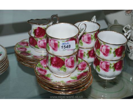 A Royal Albert ''Old English Rose'' part Teaset including six cups, saucers, tea plates, milk jug and sugar bowl.
