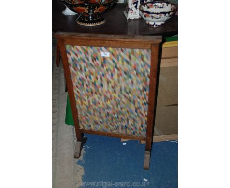 An Oak framed needlework Firescreen