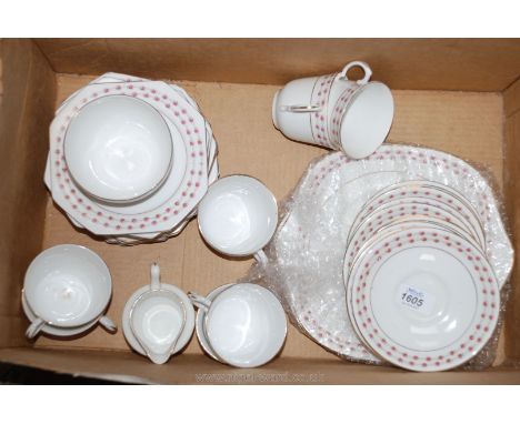 An English bone china part Teaset, white ground with pink floral banding including bread and butter plate, tea plate, cups an