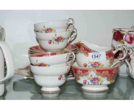 A Paragon 'Honiton' part Teaset including four cups and six saucers, tea plates, milk jug, sugar bowl and cake plate 