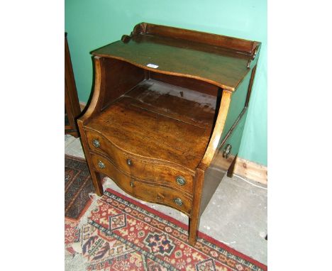 An early 19th c. Mahogany serpentine Chest Commode, having gallery back with upper shaped lifting lid, over lower lifting lid