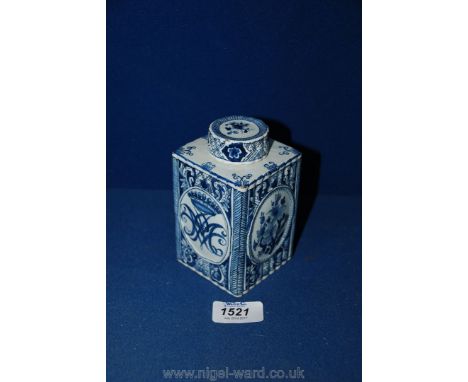 An interesting Delft tea Caddy decorated in blue with a spirographic crest surmounted by a coronet; marked for Johann Harlees