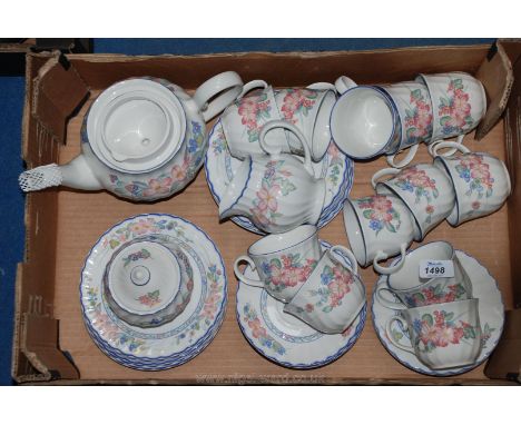 A Staffordshire 'Cherry Orchard' Teaset including teapot, twelve tea plates, twelve cups and saucers, sugar bowl and milk jug