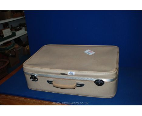 A vintage Antler ladies Suitcase with peach satin quilted interior.