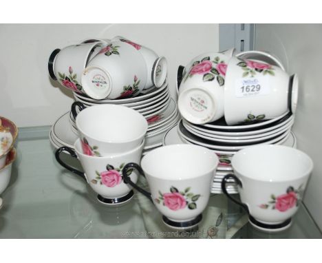 A Windsor Teaset with rose pattern, comprising twelve cups and saucers, tea plates and two bread & butter plates
