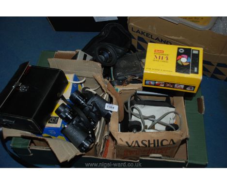 A box of miscellaneous camera equipment and cameras to include a Quartz 5 mone camera, a Nizo S8T camera various bulbs, etc