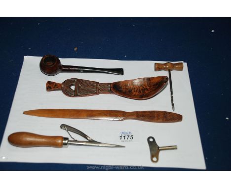 A primitive hand carved Fruitwood spoon, Westminster pipe, etc