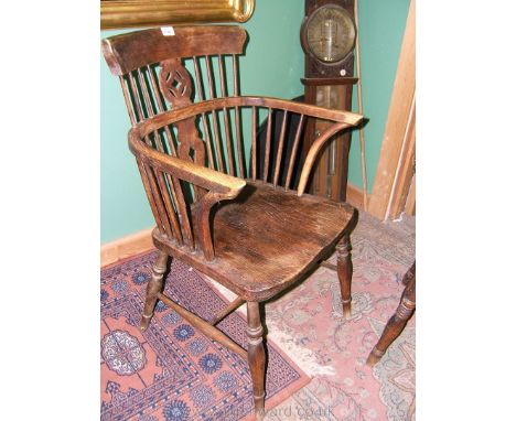 A good 19th c. Elm seated Elbow Chair, having beech top rail, single piece bent Ash arm rail running in a hoop on sixteen sti