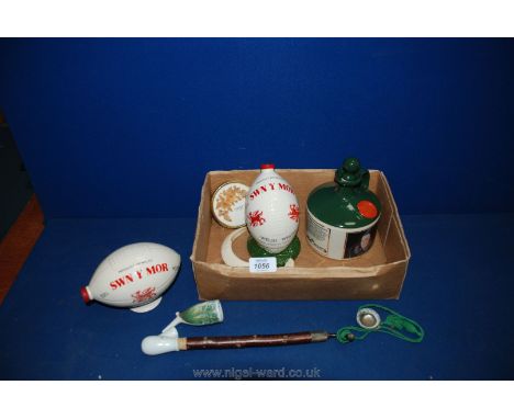 A ceramic and wood Pipe, pressed flower picture (mother), pair of boar's Tusks, etc.