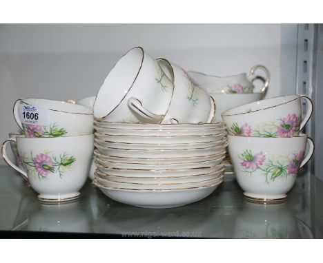 An Adderley 'Love in the Mist' Teaset comprising eleven each cups, saucers and tea plates, two bread and butter plates, sugar