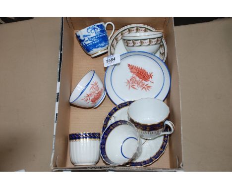A saucer and two cups and two English tea bowls and saucers.