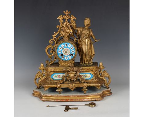 A mid to late 19th century French gilt spelter and porcelain mantel clock with eight day movement striking on a bell via an o