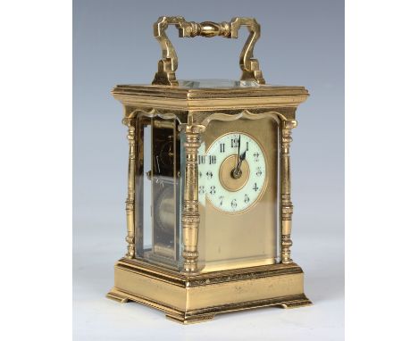 A late 19th century French lacquered brass cased carriage clock with eight day movement striking hours and half hours on a go