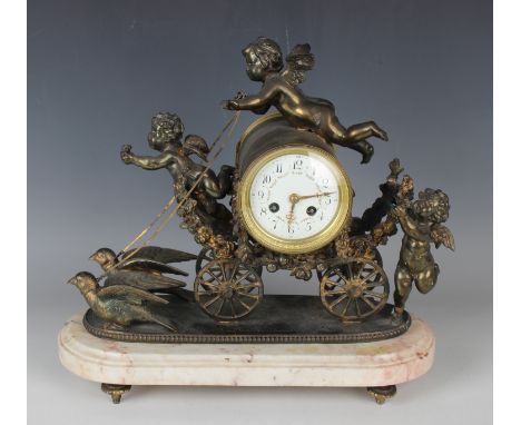 A mid to late 19th century French bronzed spelter mantel clock with eight day movement striking on a bell via an outside coun