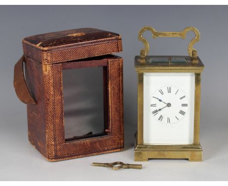 An early 20th century French brass cased carriage clock with eight day movement striking hours and half hours and repeating o