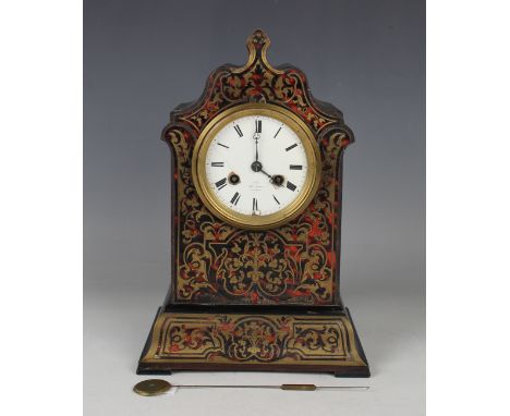 A mid to late 19th century French ebonized and red tortoiseshell boulle cased mantel clock, the eight day movement with silk 