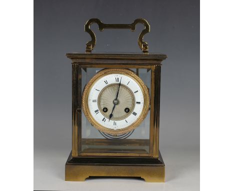 A 20th century gilt lacquered brass four glass mantel clock, the eight day movement with platform escapement and striking on 