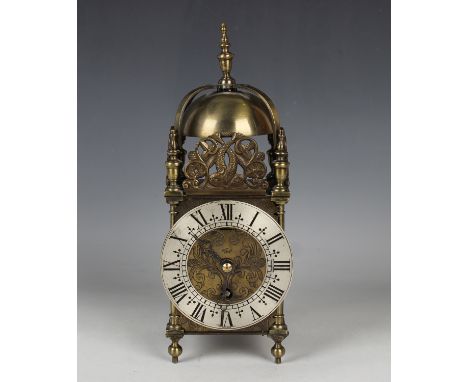 A 20th century brass lantern style mantel timepiece of typical form, the dial inscribed 'An Elliott Clock' within a silvered 