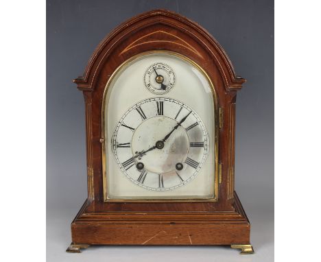An early 20th century mahogany mantel clock with eight day movement striking on two gongs, the backplate stamped 'W &amp; H S