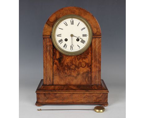 A Victorian burr walnut cased mantel clock with French eight day movement striking on a bell via on outside countwheel, the b