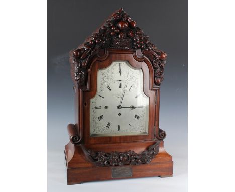 A Victorian mahogany bracket clock with eight day triple fusee movement chiming quarters on eight bells and striking hours on