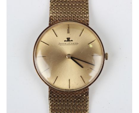 A Jaeger-LeCoultre 9ct gold gentleman's bracelet wristwatch, the signed brushed gilt dial with black baton hour markers and b