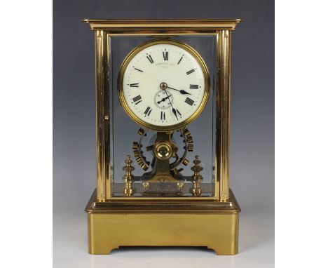 An early 20th century lacquered brass four glass electric mantel clock by Eureka Clock Co Ltd London, the signed cream circul