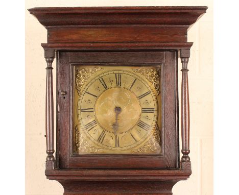 An 18th century oak longcase clock with thirty hour movement striking on a bell via an outside countwheel, the 11-inch square