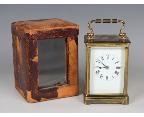 An early 20th century French lacquered brass cased carriage clock with eight day movement striking hours and half hours on a 