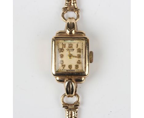 A Tissot 9ct gold cased lady's wristwatch with signed jewelled lever movement, Birmingham 1951, with a gold two row Brazil li