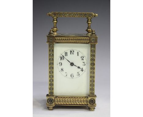 A late 19th/early 20 century lacquered brass carriage timepiece with eight day movement, the dial with Arabic hour numerals, 