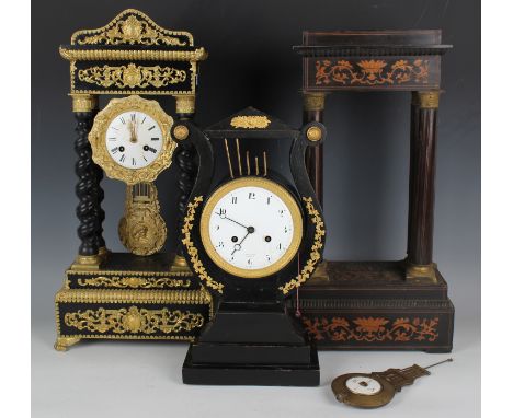 A 19th century ebonized and gilt metal mounted lyre shaped mantel clock with eight day movement striking on a gong with pull 