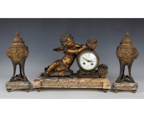 A late 19th century gilt spelter and rouge marble mantel clock with eight day movement striking on a bell, the drum case flan