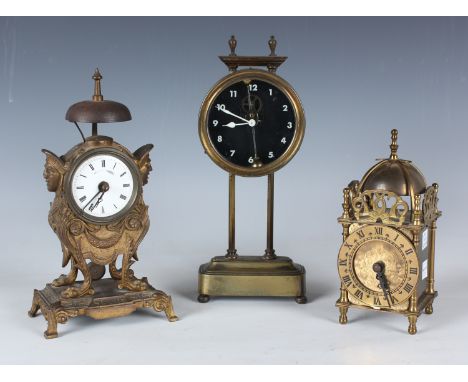 An early 20th century brass gravity mantel timepiece, the glass dial with white Arabic hour numerals, the case back stamped '