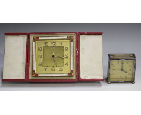 An Art Deco gilt metal and enamelled bedside alarm clock, the gilt dial with Arabic hour numerals, the square case with white